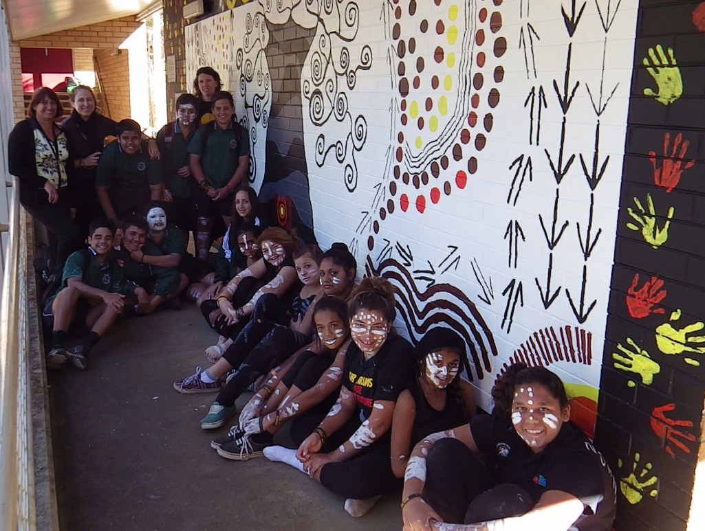 ONE MOB: Designers, artists, dancers and teachers with the mural.